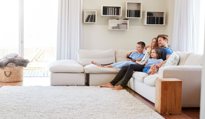 A family enjoying in a smoke-free living room