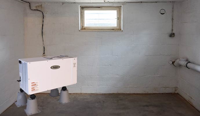 An installed basement dehumidifier system