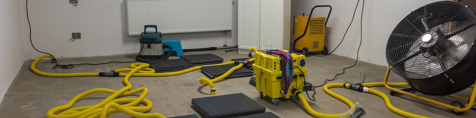 Drying water-damaged floor using professional equipment