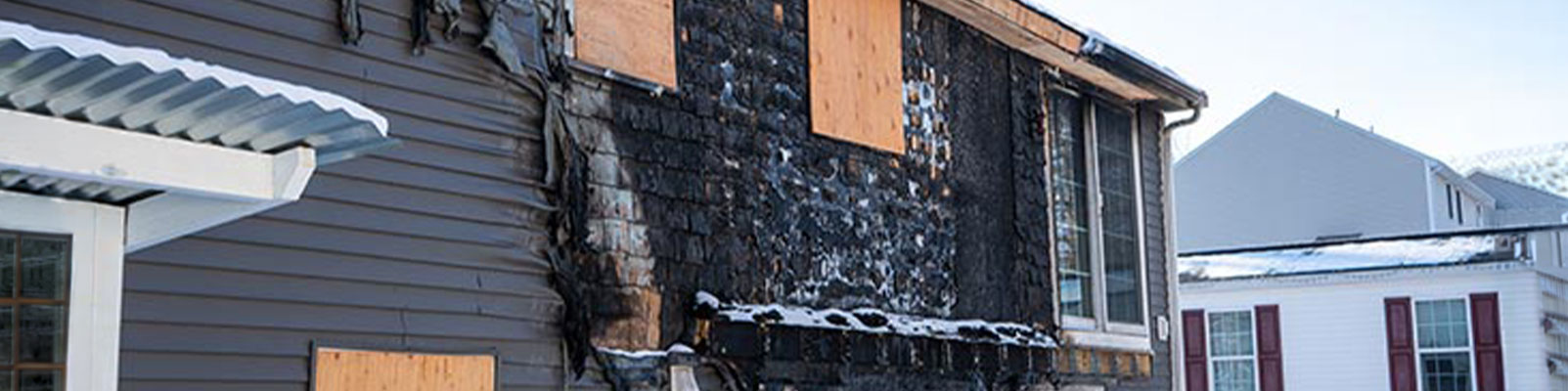 Fire damaged house banner