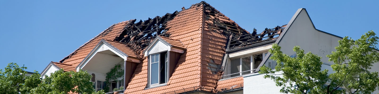 Fire damaged house banner