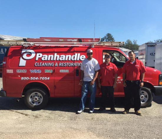 Panhandle Cleaning and Restoration team with service van.