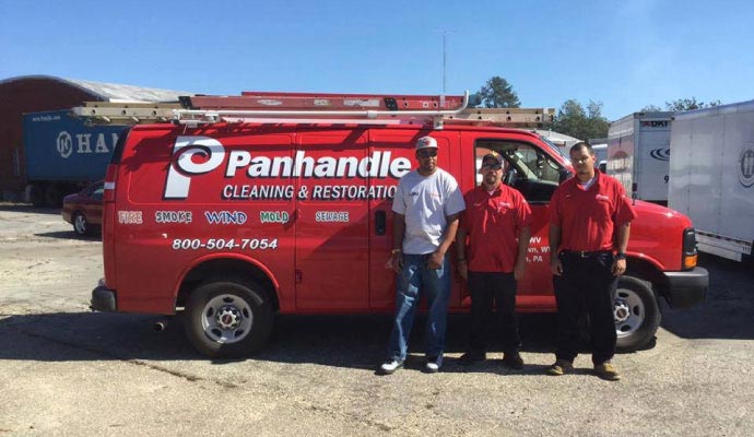 Panhandle Cleaning and Restoration team with service van.