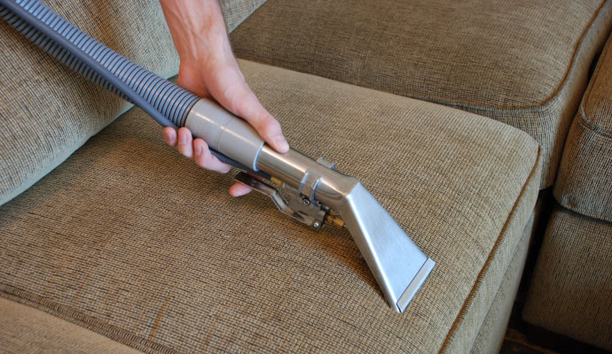Cleaning sofa cushions to remove grime and stains