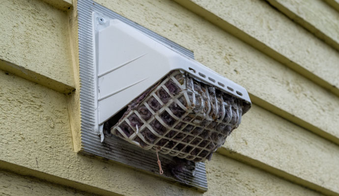 Clogged dryer vent in exterior wall