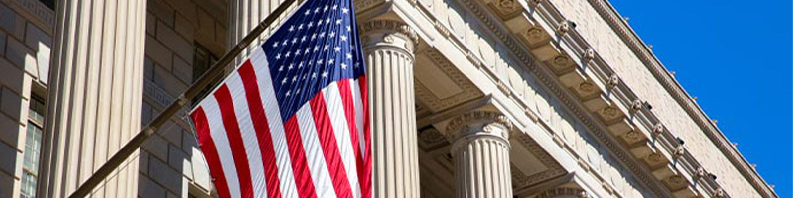 USA flag hoisted in front of government office