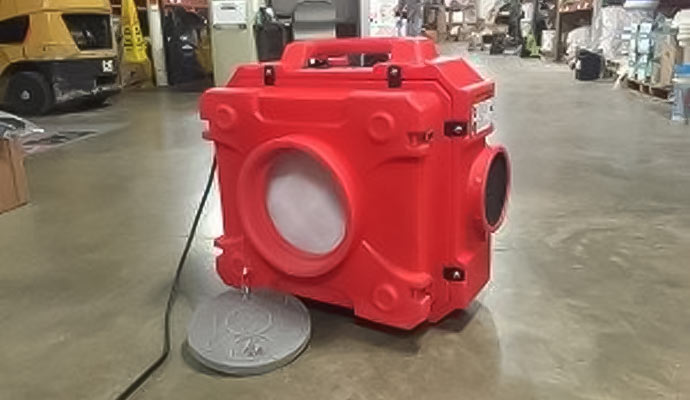 Red air scrubber on the floor