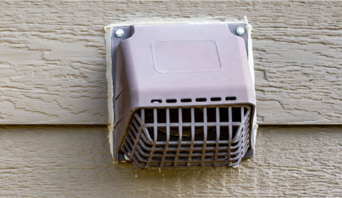 Exterior dryer vent covered with a pest guard