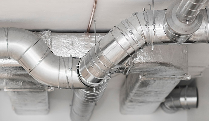 A network of round steel ventilation pipes