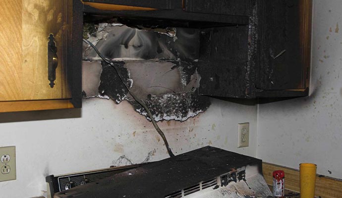 Electrical fire damage on cabinets