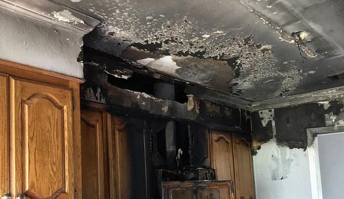 Fire damaged ceiling and wooden property