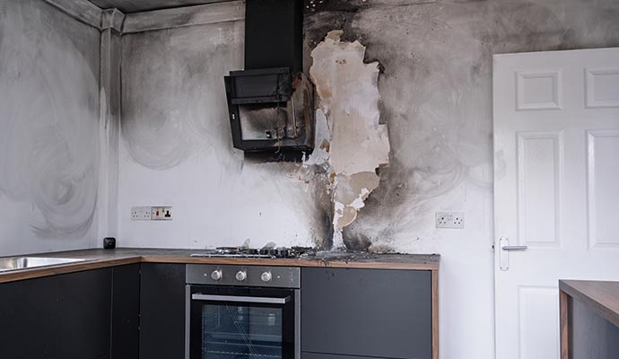 Fire damaged extractor hood in kitchen