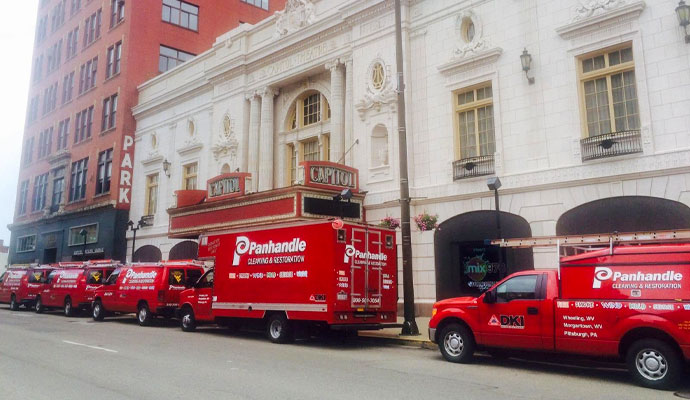 Panhandle Cleaning & Restoration emergency response service vehicles parked on a street