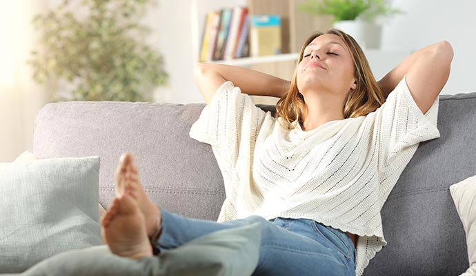 Woman relaxing on sofa