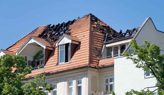 Roof severely damaged by fire Roof severely damaged by fire
