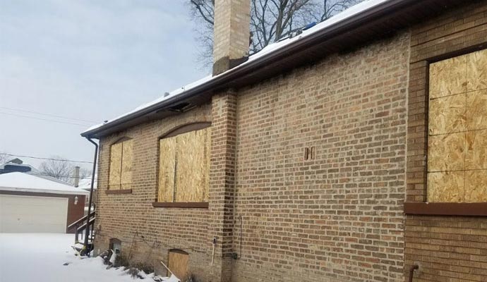 A house with boarded-up windows