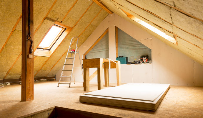 Interior view of a bright attic being restored