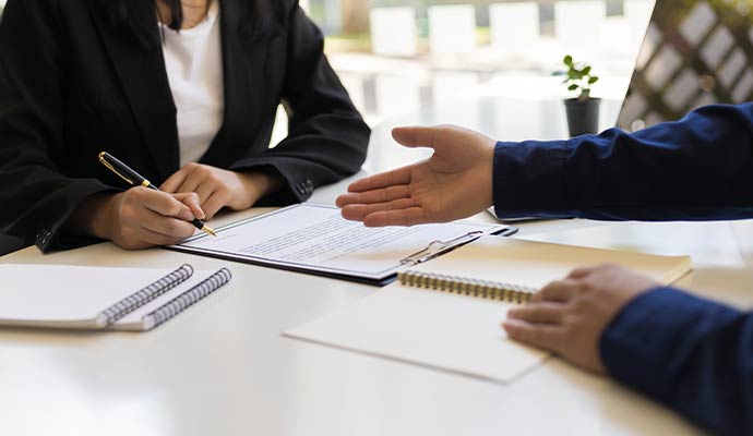 Person signing an insurance document