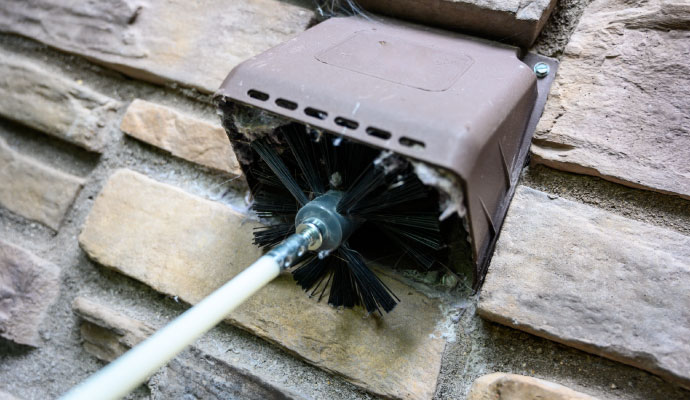 Professional dryer vent cleaning with brush