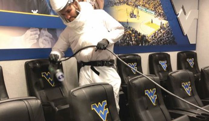 Professional spraying disinfectants in a commercial space