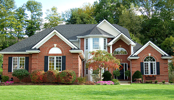 Residential home exterior with landscaped yard