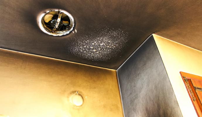 Ceiling severely damaged by smoke after a fire