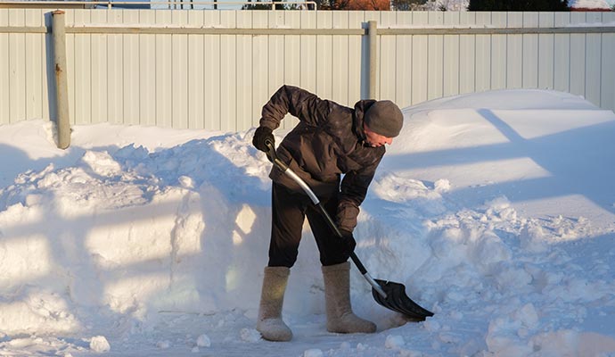 Person removing snow after snowfall