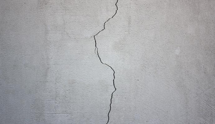 Vertical crack in a concrete foundation wall.
