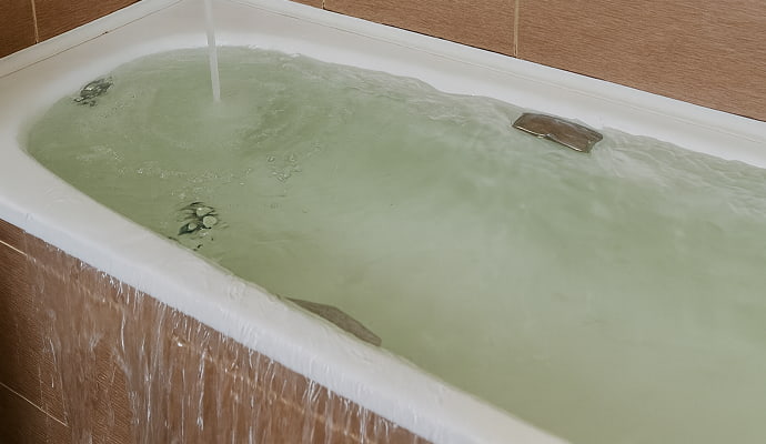 Water overflowing from bathtub