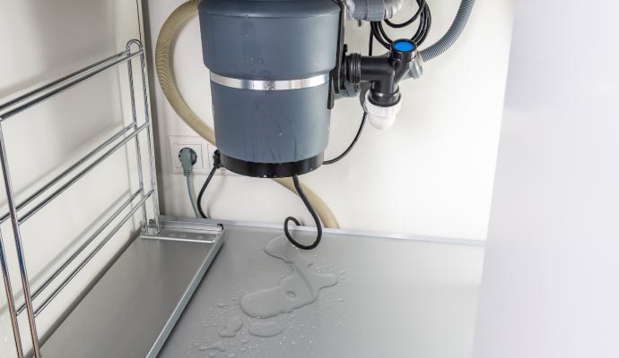 Leaking garbage disposal under the sink