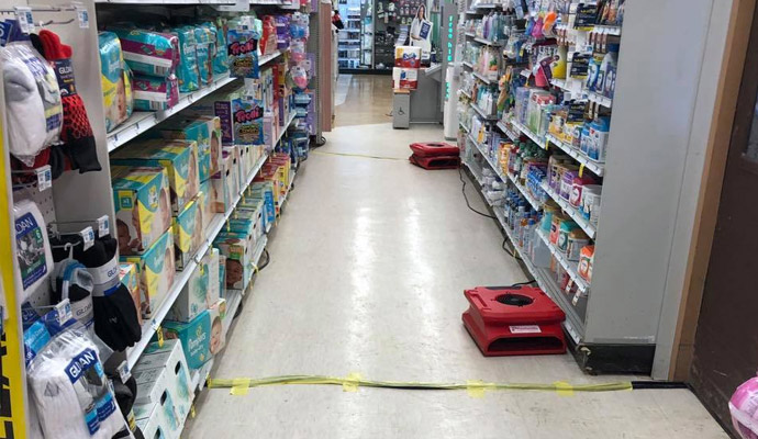 Water damaged retail store floor restoration service